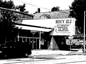 A black and white drawing of a building the sign says Roxy 1 and 2