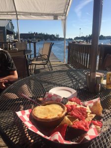 A picture of chips and dip, overlooking the water at Coleman's Dock of the Bay.