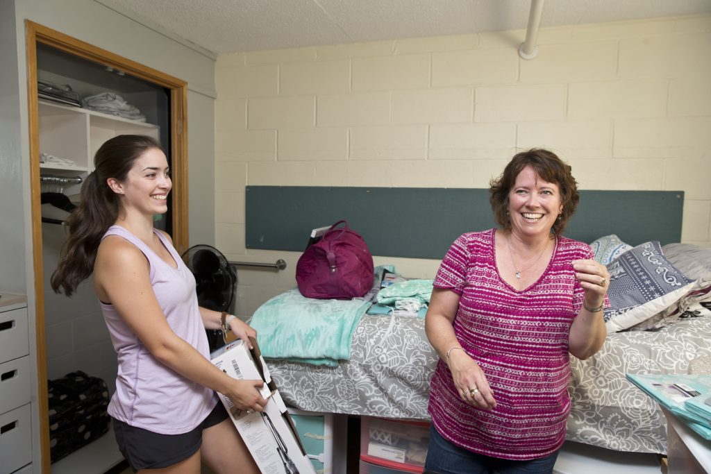 Clarkson student Katie Derouchie and her mom set up her first year residence hall room during move in. 