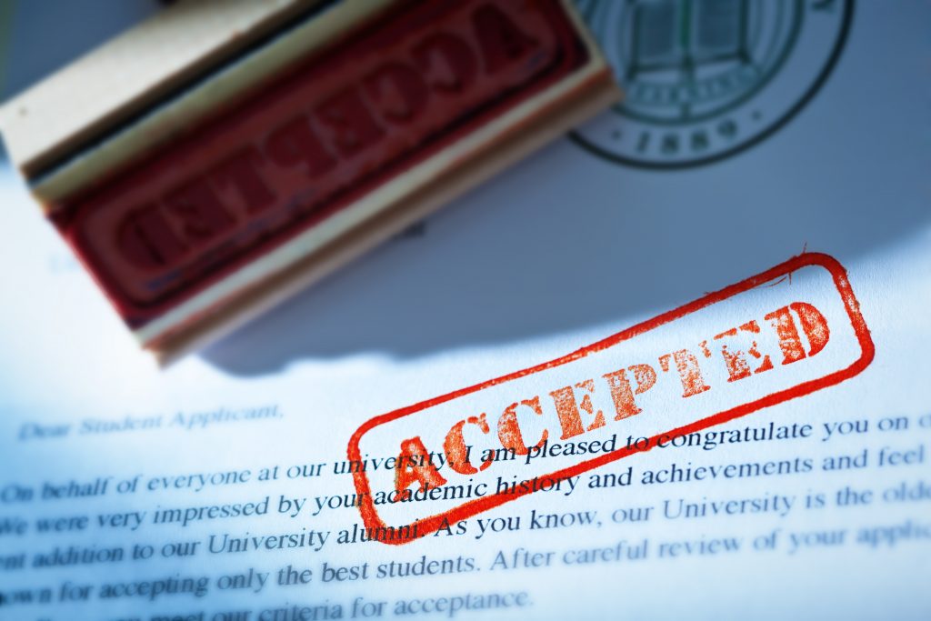 In red ink the word "ACCEPTED" is stamped on an application letter.