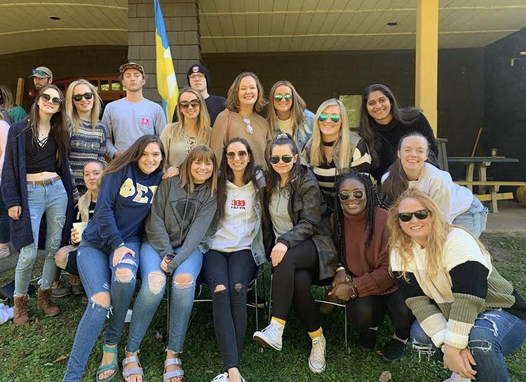 Students of Clarkson University smiling. They are participating in the annual Sigma Chi Derby Days philanthropic event.