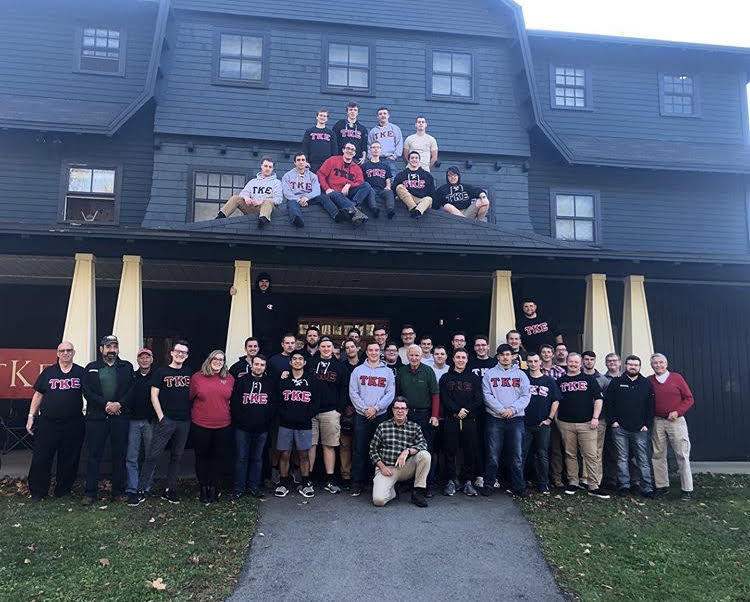 Fraternity brothers of Tau Kappa Epsilon in front of their house