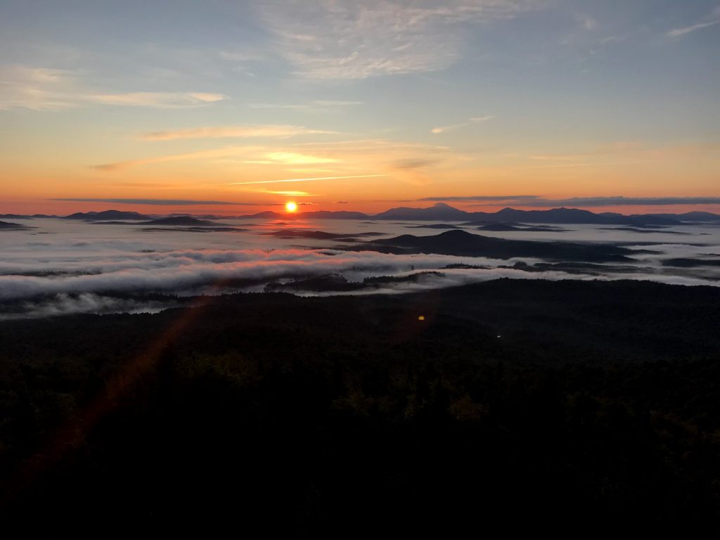 The sunrise over the Adirondack Mountains.