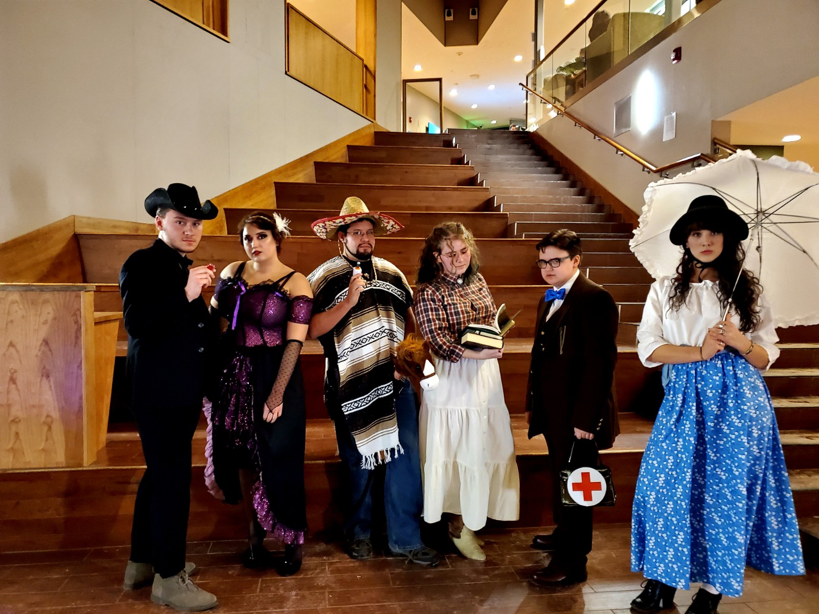 Clarkson Theatre Company actors dressed in characters in the Student Center Atrium