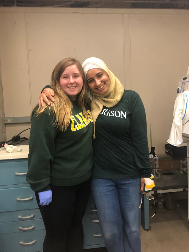 Megan and Fatima wearing Clarkson hoodies
