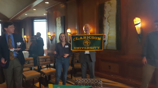 Jackie and Tony Collins, who is holding a Clarkson flag, at a Clarkson event in the San Francisco area