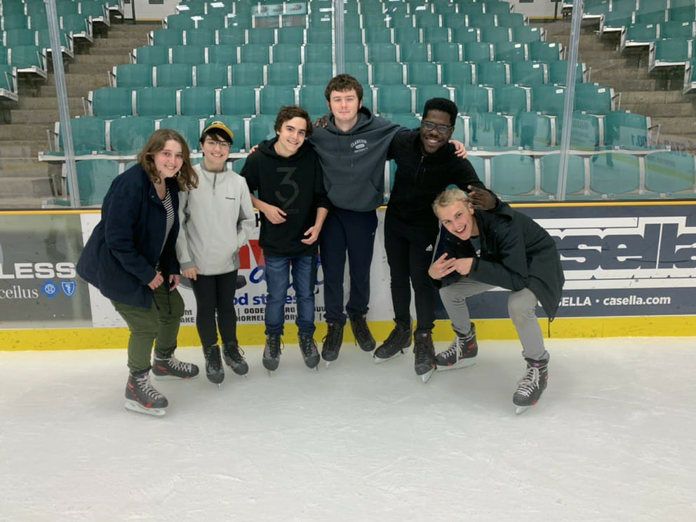 A group of six students skating at Clarkson's Cheel Arena