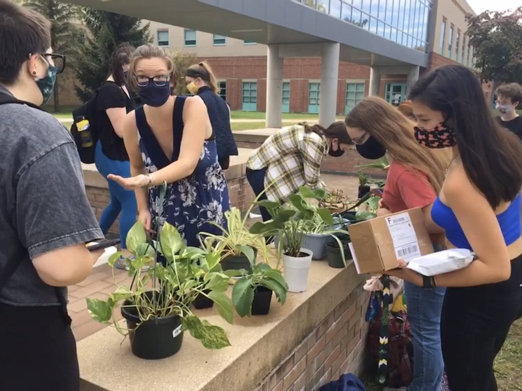Clarkson students enjoying the plant swap event help by the Sustainability Club.