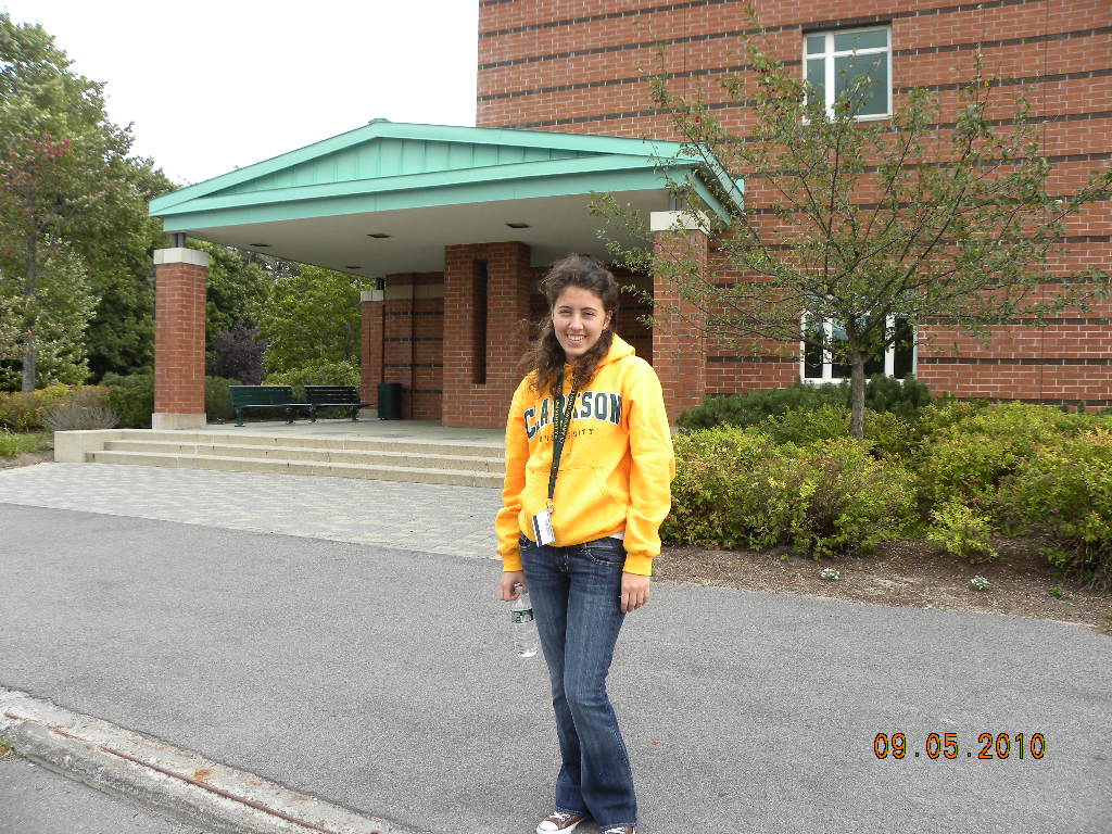 Clarkson alumna Jennifer Karekos '14 poses outside BH Snell Hall on campus as a first year student.