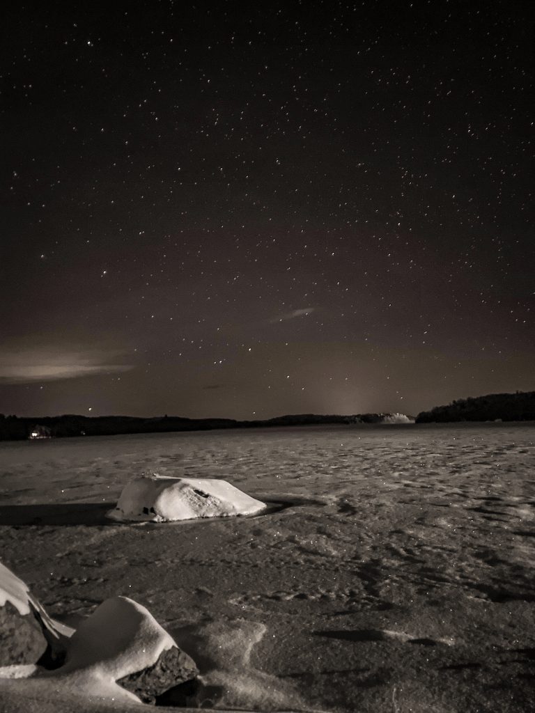 starry sky over a frozen plain