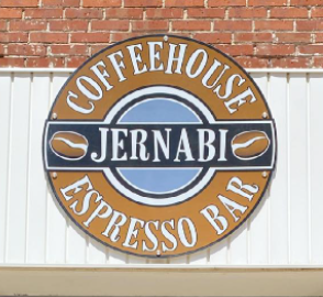 A photo of the outside of Jernabi Coffeehouse & Espresso Bar, focused on the business logo.