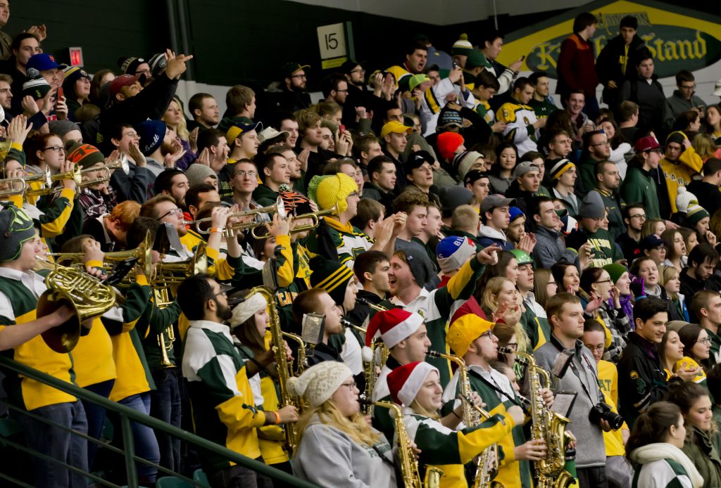 The Clarkson University Pep Band and a full student section in Cheel arena during a hockey game