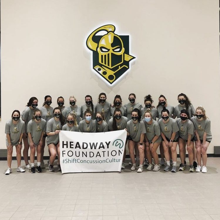 Clarkson student Julia Lavarnway poses with her fellow lacrosse team members during an event about concussion awareness.