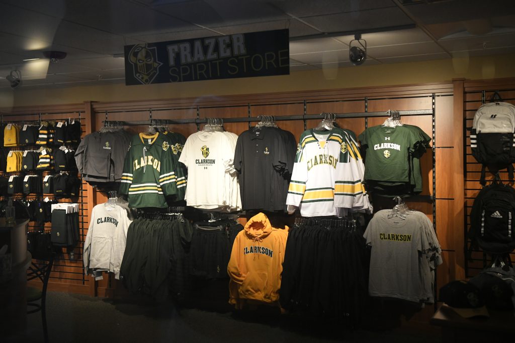 Shirts hanging on a wall display at the Spirit Store in Cheel Arena