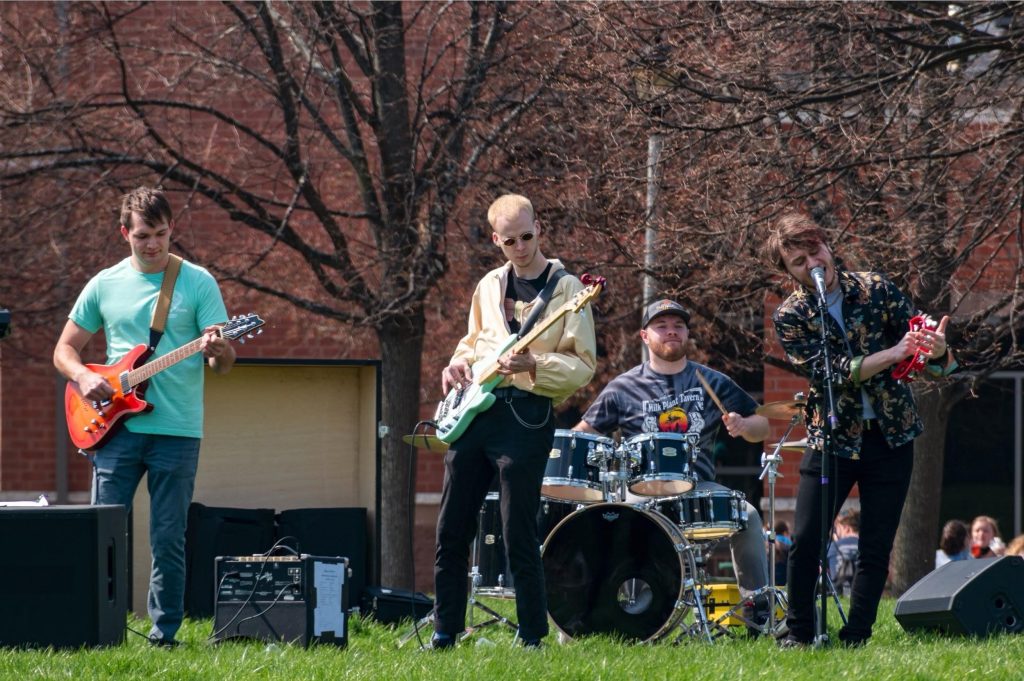 A band plays outside on campus.