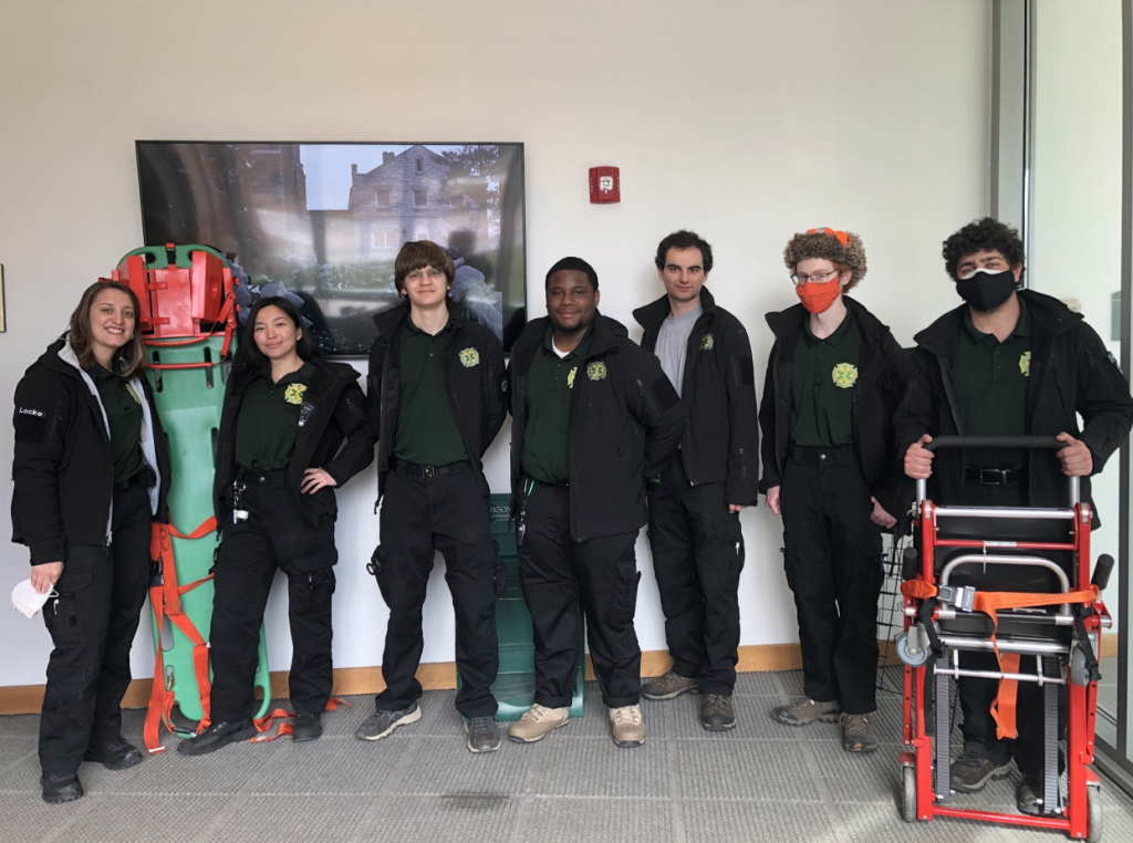 A group of Clarkson EMS students pose with medical equipment