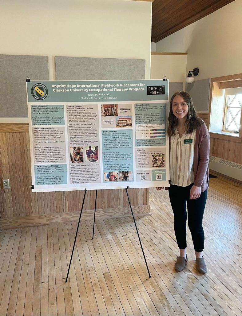Jenna standing next to a poster displaying her project.