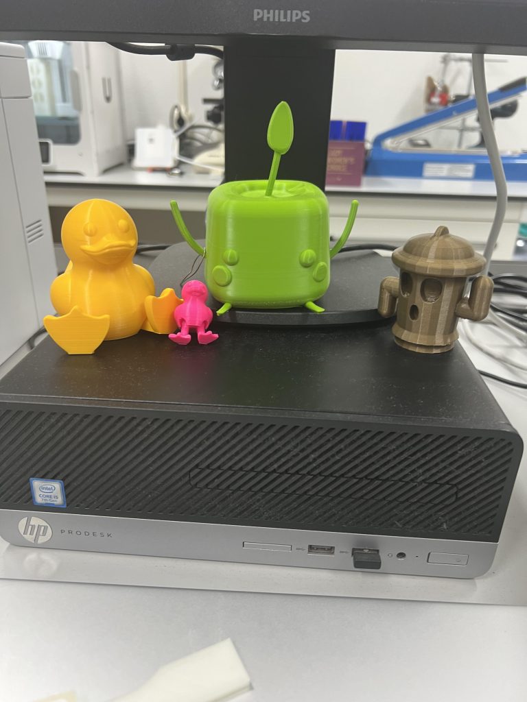 A picture of 4 objects that had been 3D printed for her desk