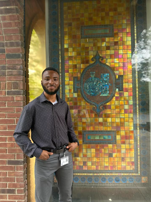 Clarkson University PhD Student Paul Akinyemi poses for a photo at Corning Incorporated during his internship experience.