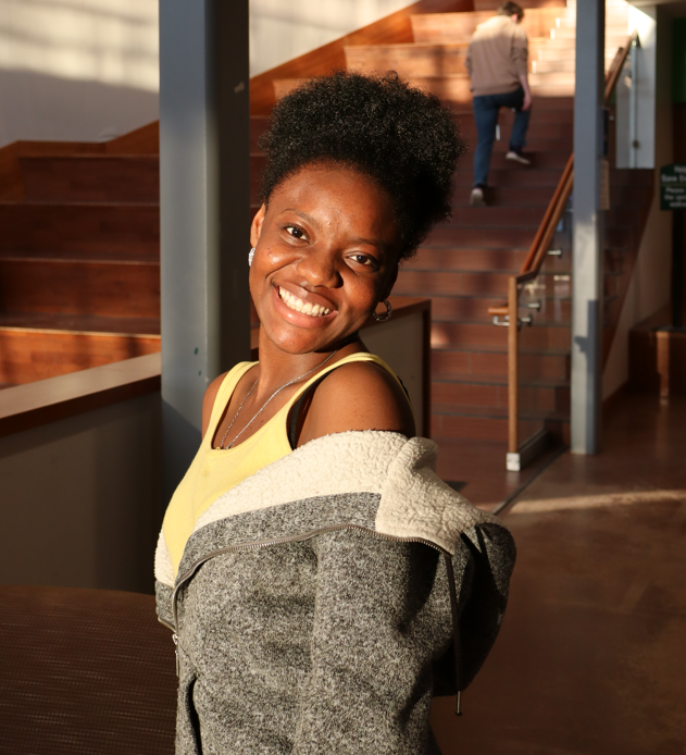 Chidi poses for a portrait in the Student Center Forum at Clarkson University