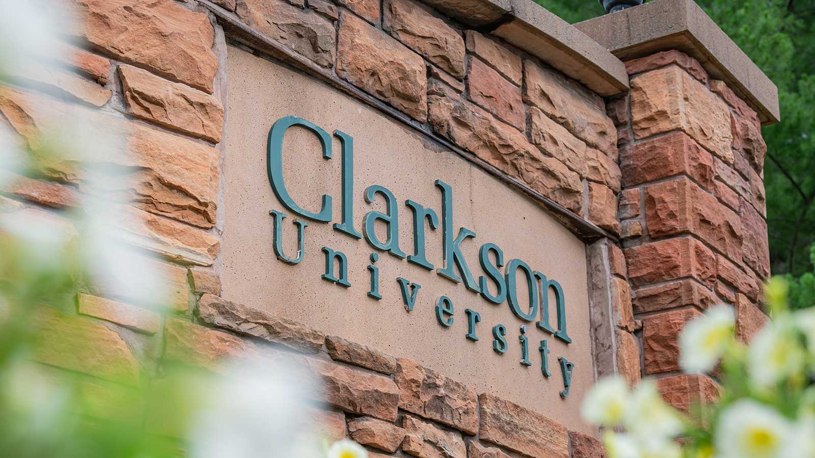 Red Potsdam Sandstone brick wall with Clarkson University inscribed