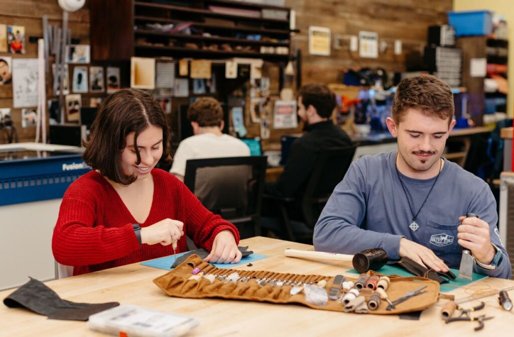 Two students work on projects in the Dorf Makerspace in the ERC at Clarkson University
