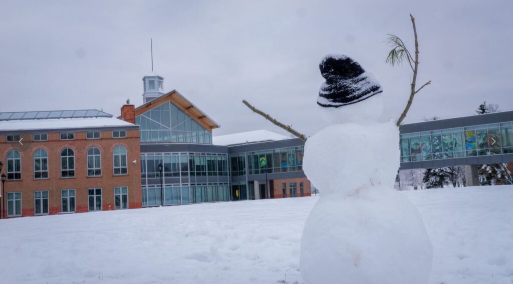 A student-made snowman pictured in front of the Student Center at Clarkson University on Cheel Lawn