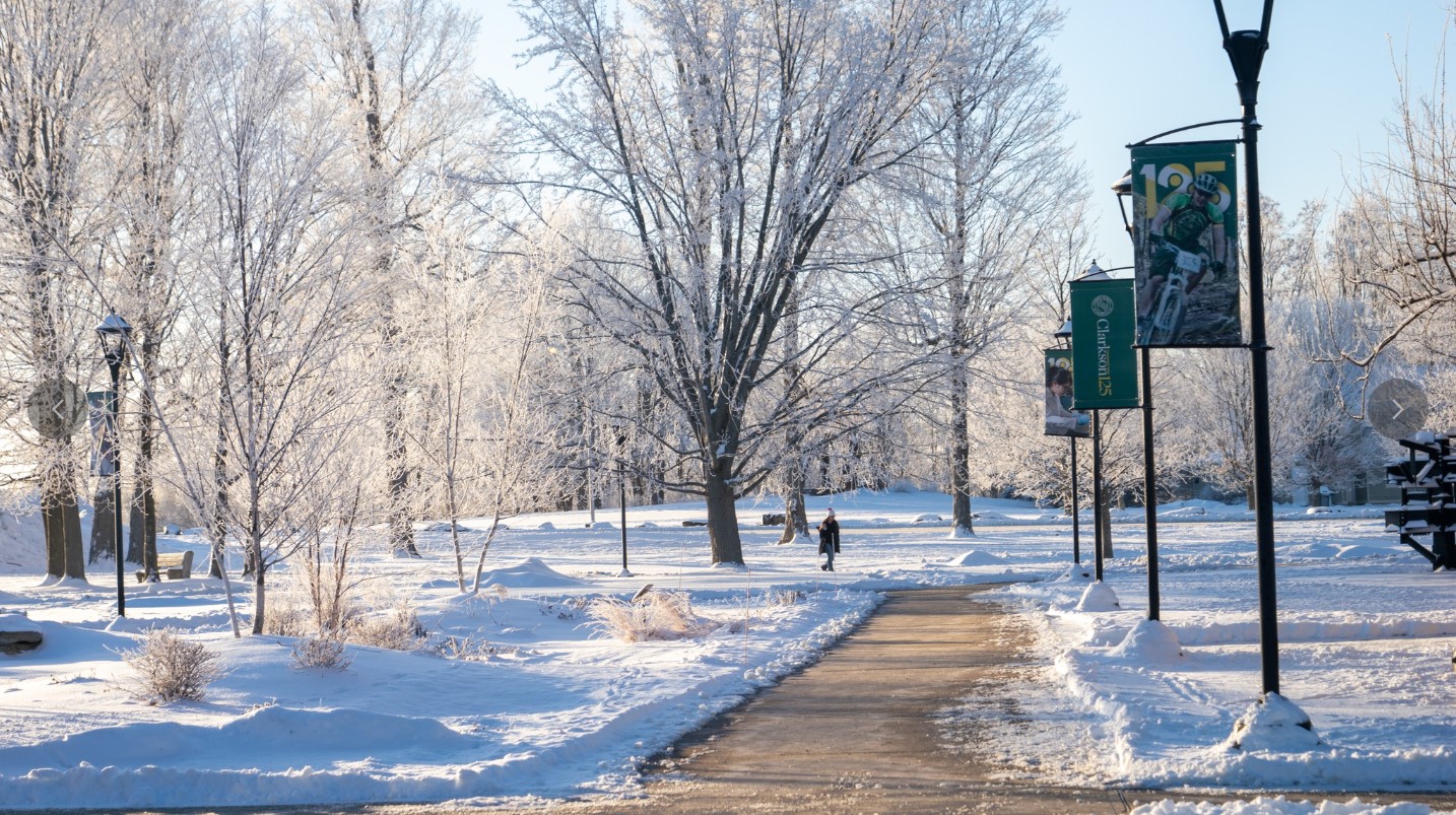 Snowy Landscape at Clarkson University depicting walkways outside