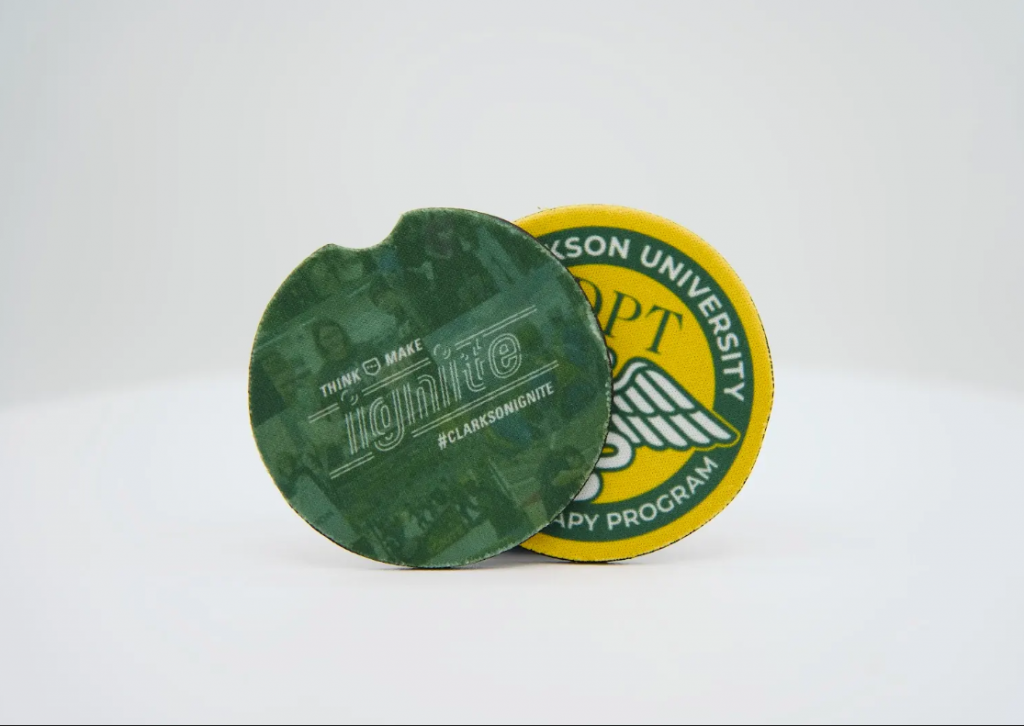 Two coasters, branded with the Ignite and Department of Physical Therapy logos, are seen.