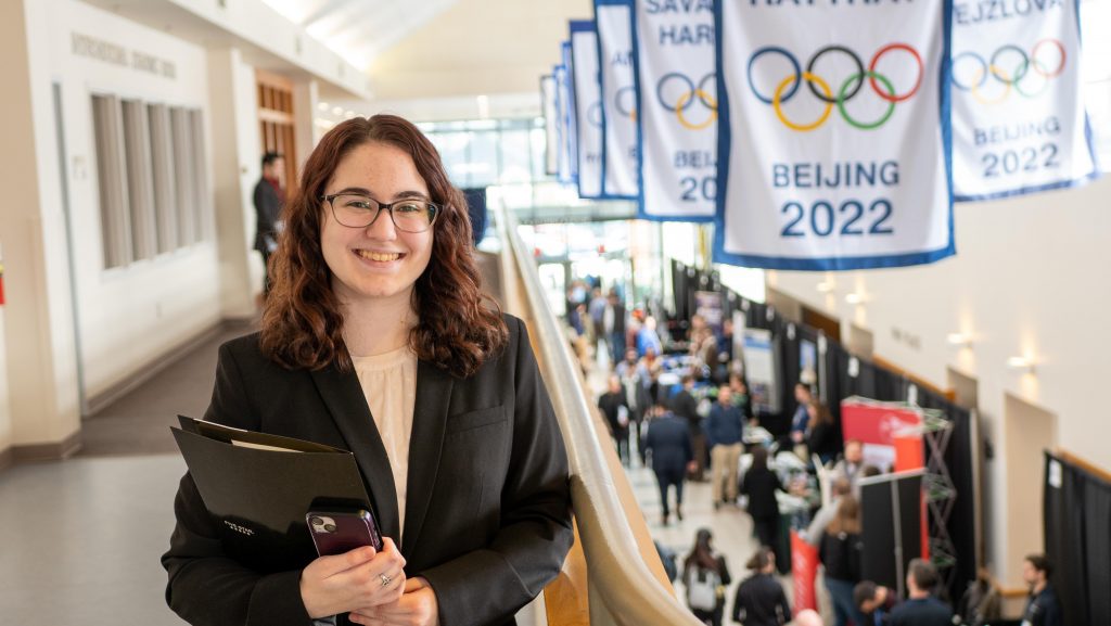 Lindsey Hassett, an Electrical and Computer Engineering student at Clarkson University, smiles in business attire during Clarkson’s spring Career Fair, showcasing student readiness for professional opportunities.