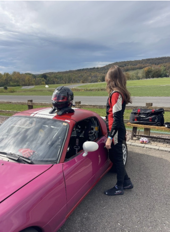 Pre-session at Pineview Run. The Miata, the helmet on the seat, the notebook in hand. 
