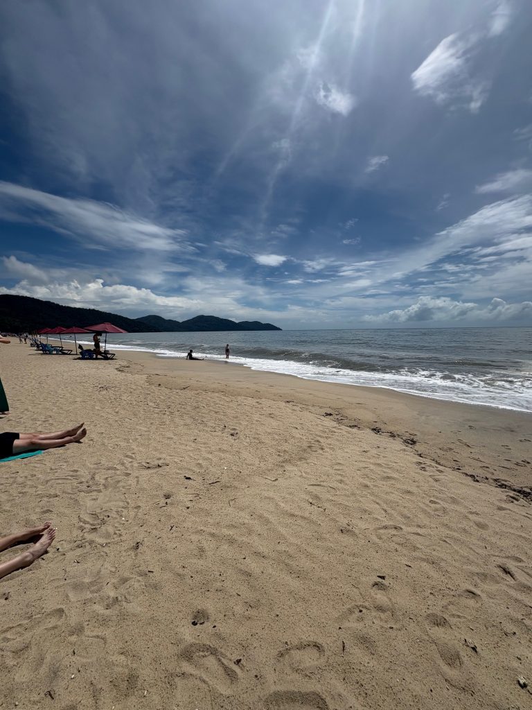 Picture of a beach with a mountain in the background